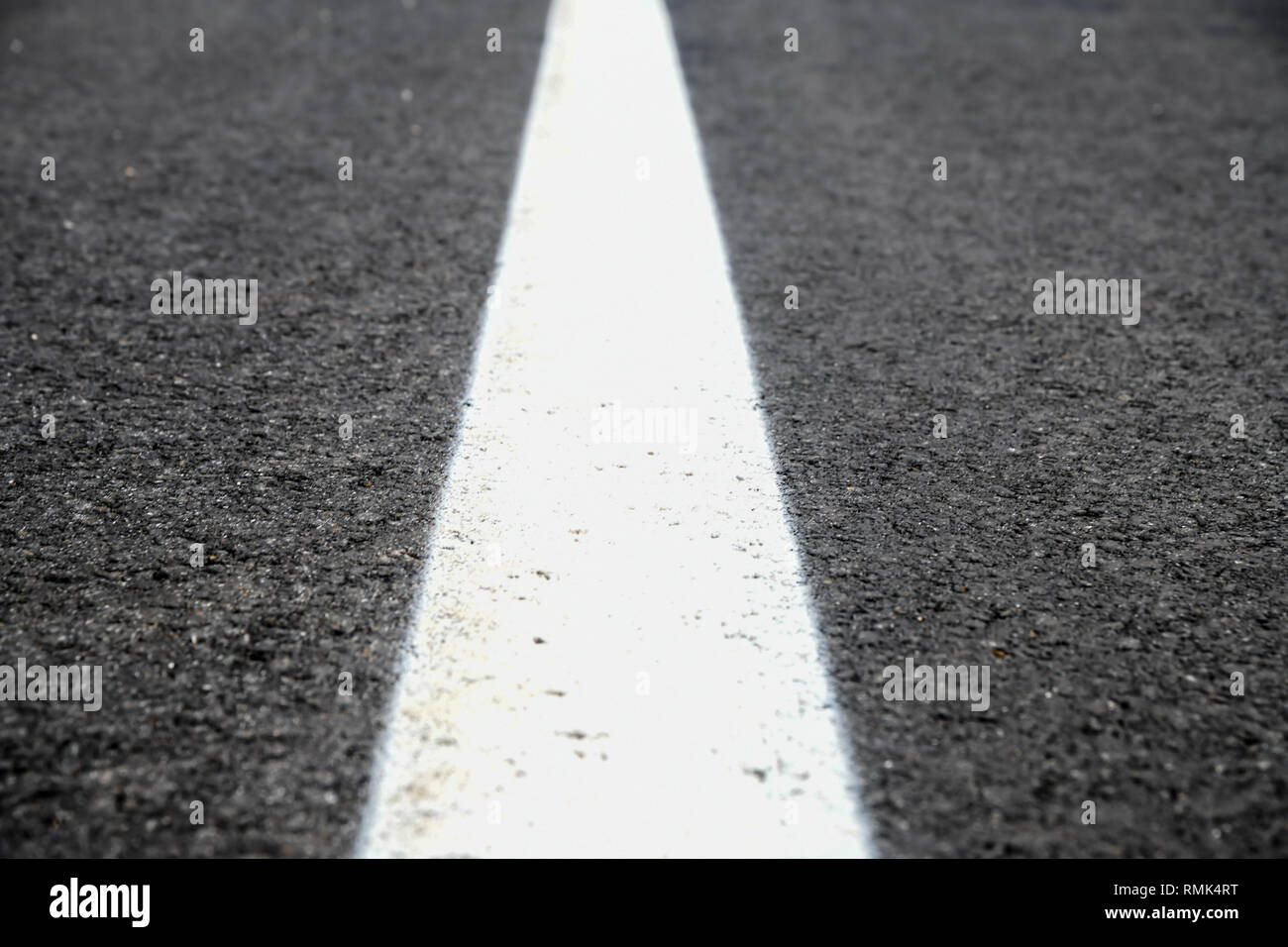 Asphalt road texture with white reflecting line. New road, surface a new asphalt highway Stock Photo