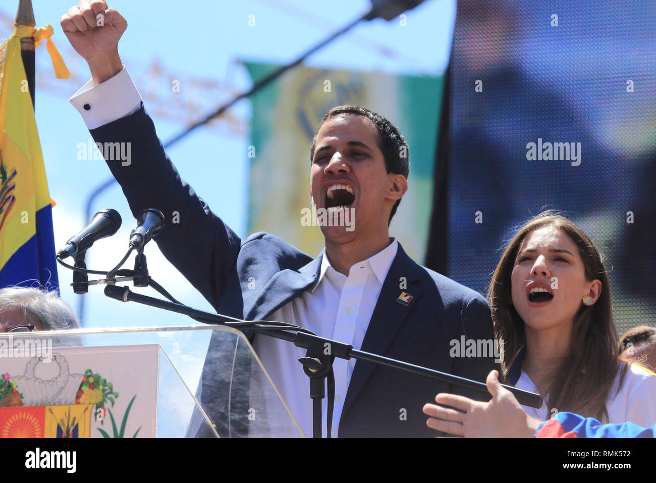 Caracas, Venezuela February 12, 2019: Venezuelan opposition leader Juan Guaido interim ruler and wife Fabiana Rosales singing the national anthem Stock Photo