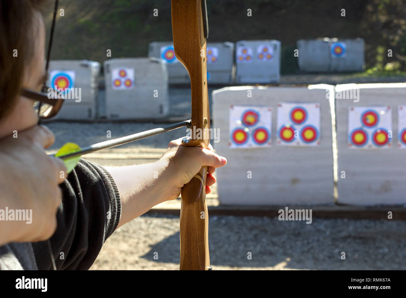 Archery or shooting range with bow and arrows on a sunny outdoor