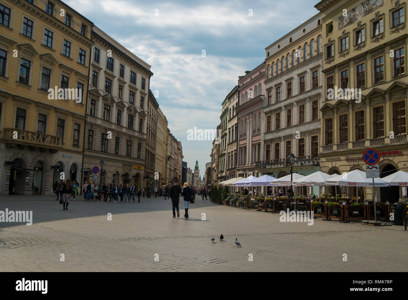 Old apartments line a street off the main square in Krakow, Poland. Stock Photo