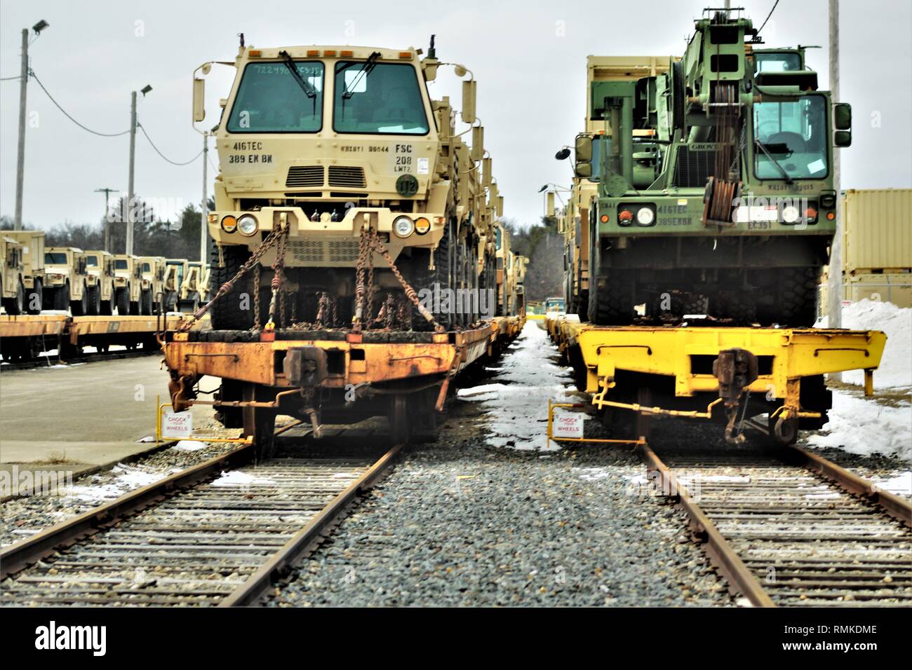 Military vehicles and equipment with the 389th Engineer Battalion is loaded on railcars Feb. 5, 2019, at the rail yard at Fort McCoy, Wis. The movement is for the 389th’s future involvement in Operation Resolute Castle 2019 in Poland. Unit Soldiers loaded 38 cars with vehicles and equipment after receiving training in a rail head operations class by representatives of Marine Corps Logistics Base-Barstow, Calif. Fort McCoy’s Logistics Readiness Center personnel assisted with the loading operations. (U.S. Army Photo by Scott T. Sturkol, Public Affairs Office, Fort McCoy, Wis.) Stock Photo