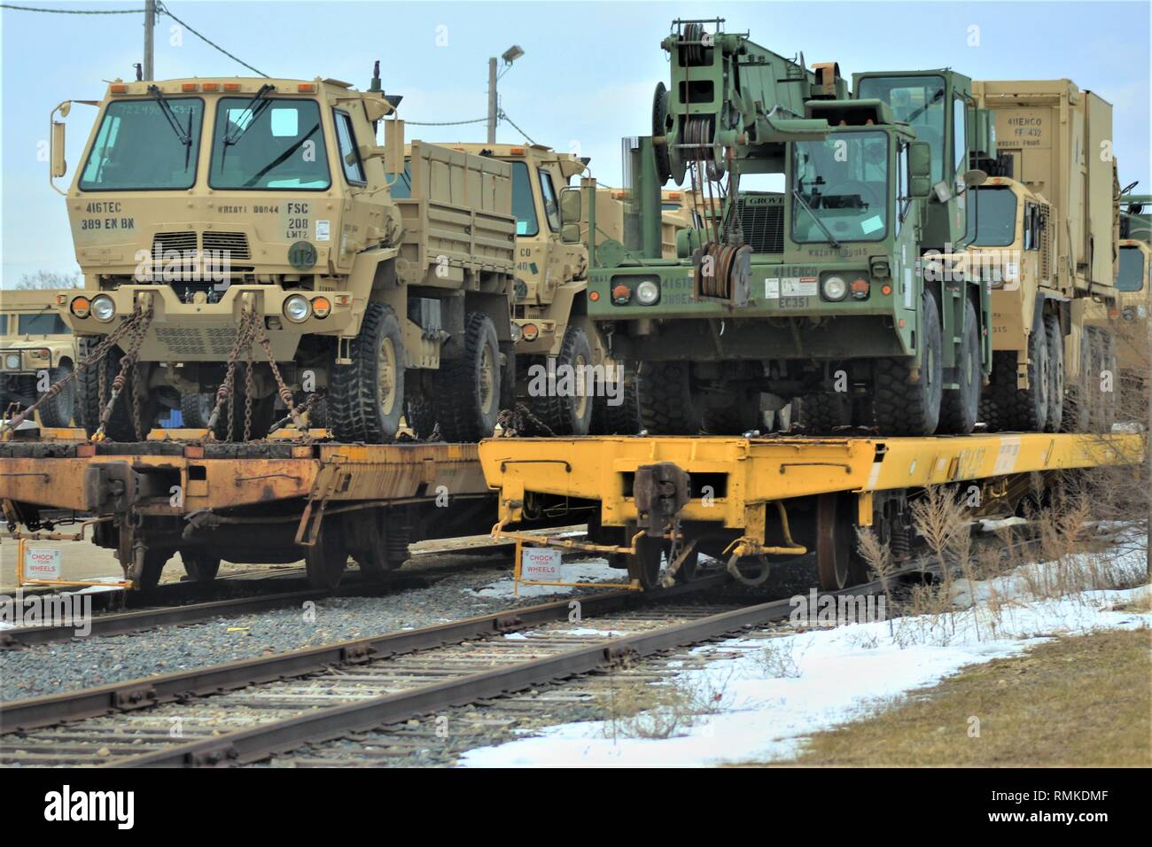 Military vehicles and equipment with the 389th Engineer Battalion is loaded on railcars Feb. 5, 2019, at the rail yard at Fort McCoy, Wis. The movement is for the 389th’s future involvement in Operation Resolute Castle 2019 in Poland. Unit Soldiers loaded 38 cars with vehicles and equipment after receiving training in a rail head operations class by representatives of Marine Corps Logistics Base-Barstow, Calif. Fort McCoy’s Logistics Readiness Center personnel assisted with the loading operations. (U.S. Army Photo by Scott T. Sturkol, Public Affairs Office, Fort McCoy, Wis.) Stock Photo