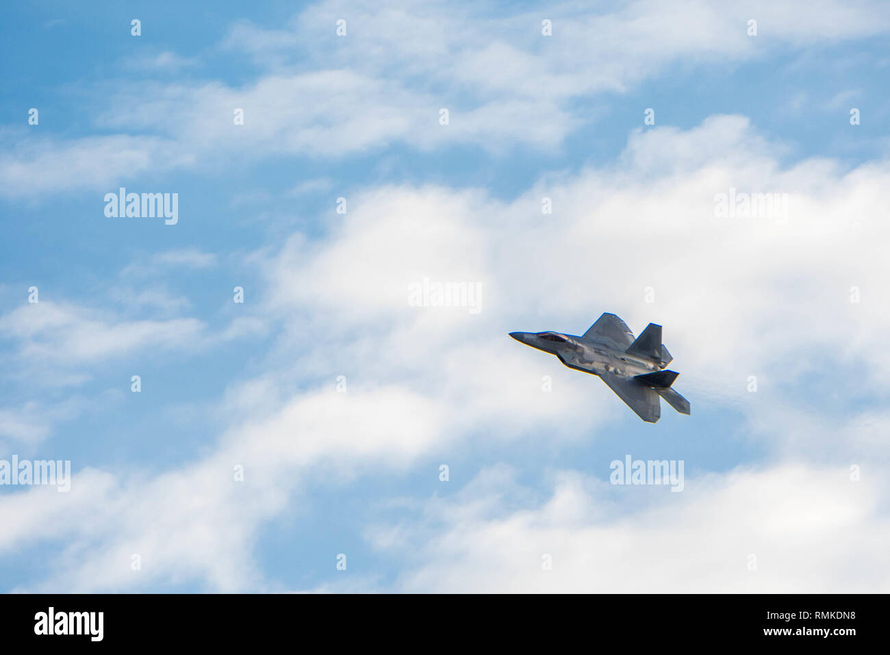 F-22 Demo Team pilot, Major 'Loco' Lopez performs during a demo team practice on Joint Base Langley-Eustis, February 13th, 2019.The team performs precision aerial maneuvers to showcase the capabilities of the F-22 Raptors, as well as educate the public about the 5th generation aircraft. Stock Photo