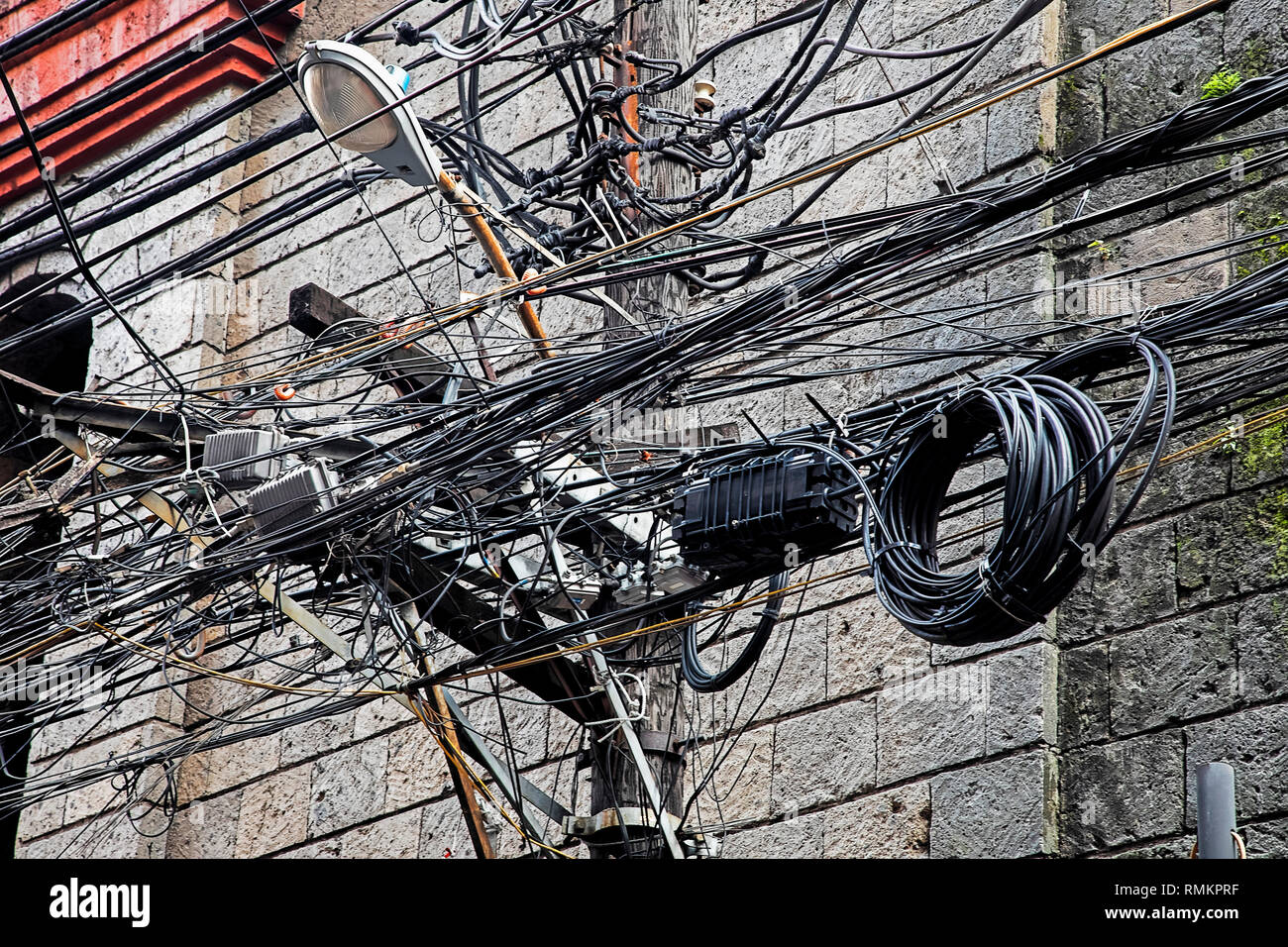 Massive Tangle of cables and wires in the Chinatown area of the city of Manila, Philippines Stock Photo
