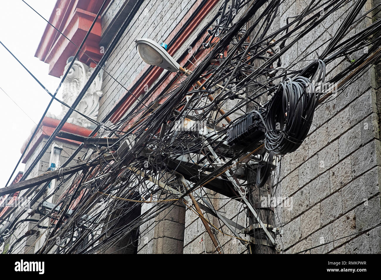 Massive Tangle of cables and wires in the Chinatown area of the city of Manila, Philippines Stock Photo