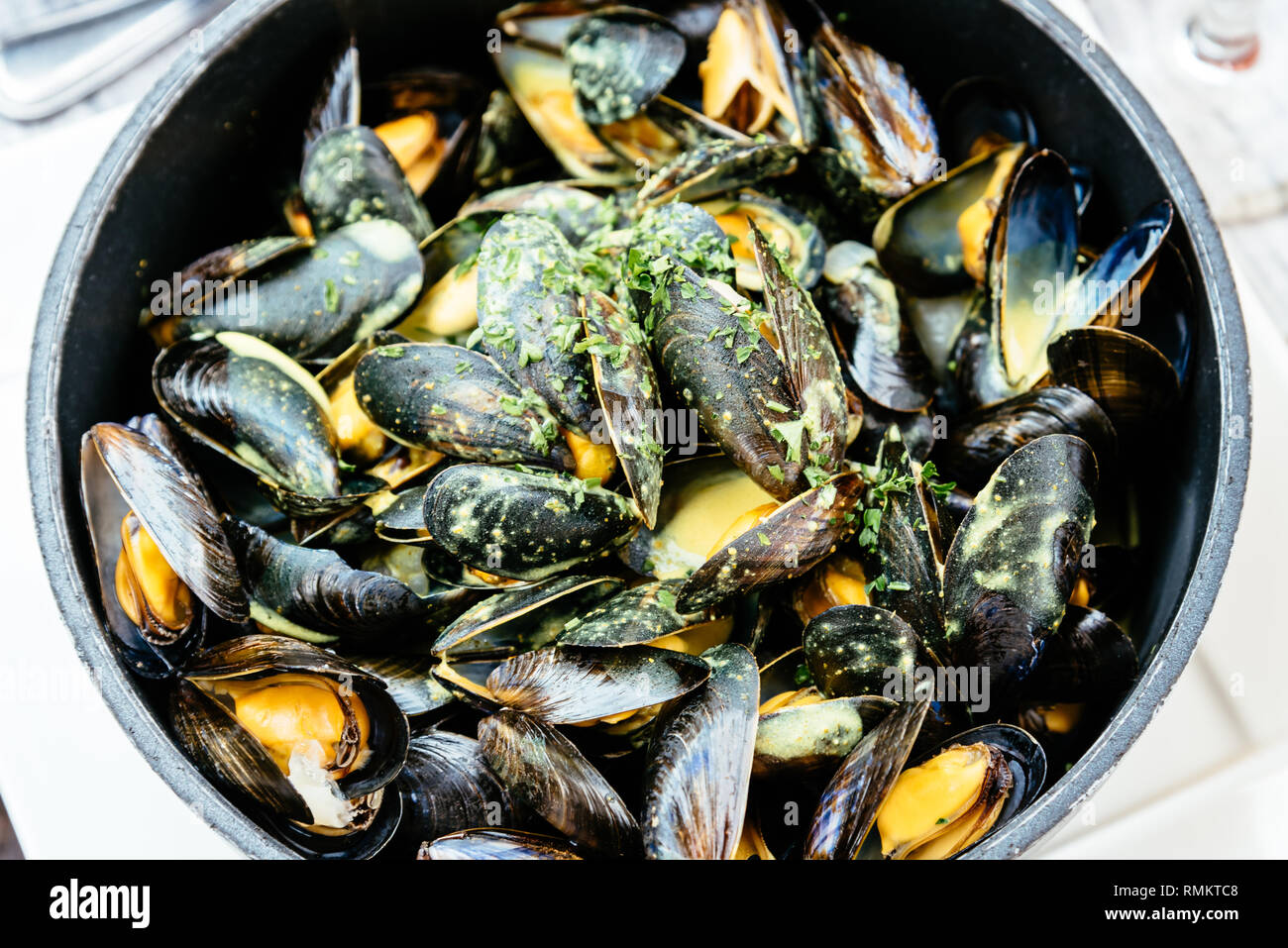 Steamed mussels with parsley, wine and curry, a typical food from