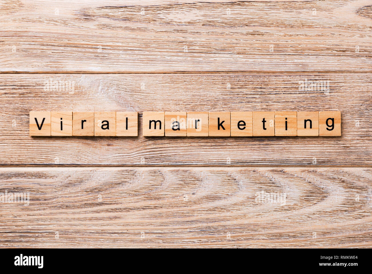Viral markeing word written on wood block. Viral markeing text on wooden table for your desing, concept. Stock Photo