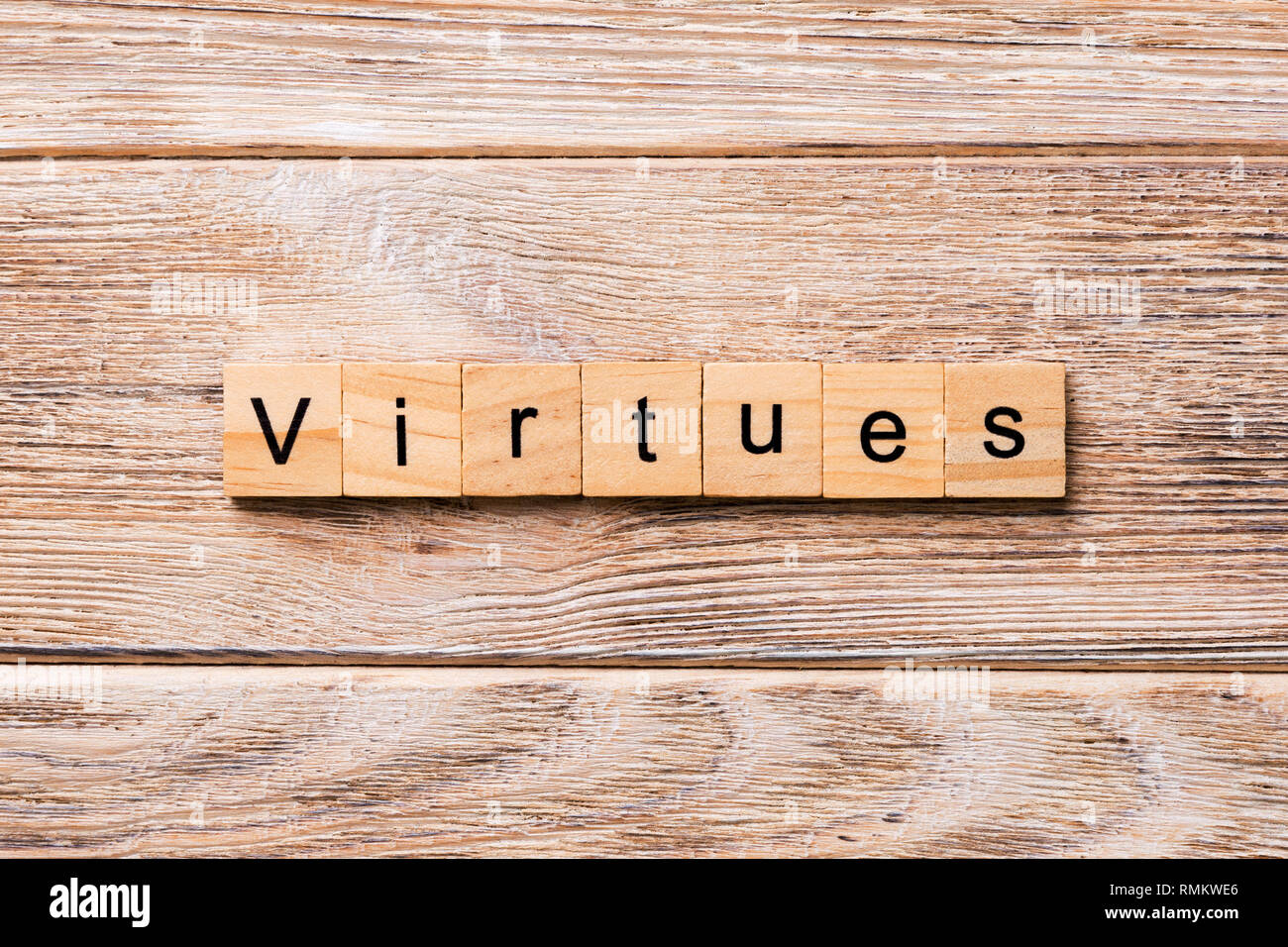 virtues word written on wood block. virtues text on wooden table for your desing, concept. Stock Photo