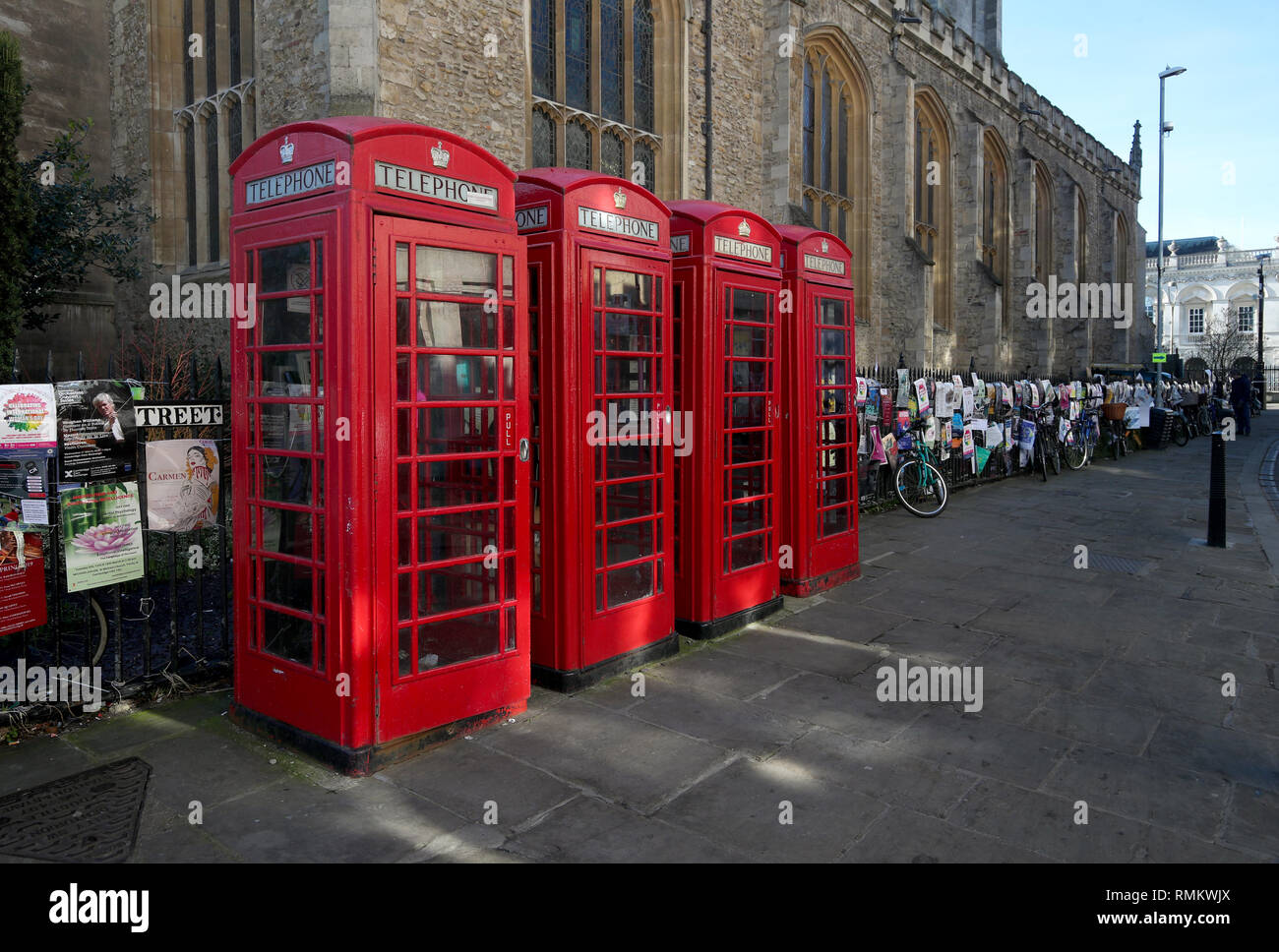 A row of four Red Telephone Boxes in the centre of Cambridge UK. Stock Photo