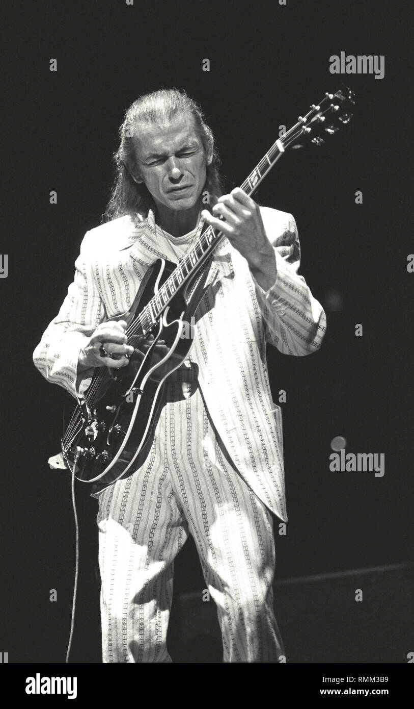 Guitarist Steve Howe of Anderson, Bruford, Wakeman & Howe is shown performing on stage during a 'live' concert appearance. Stock Photo
