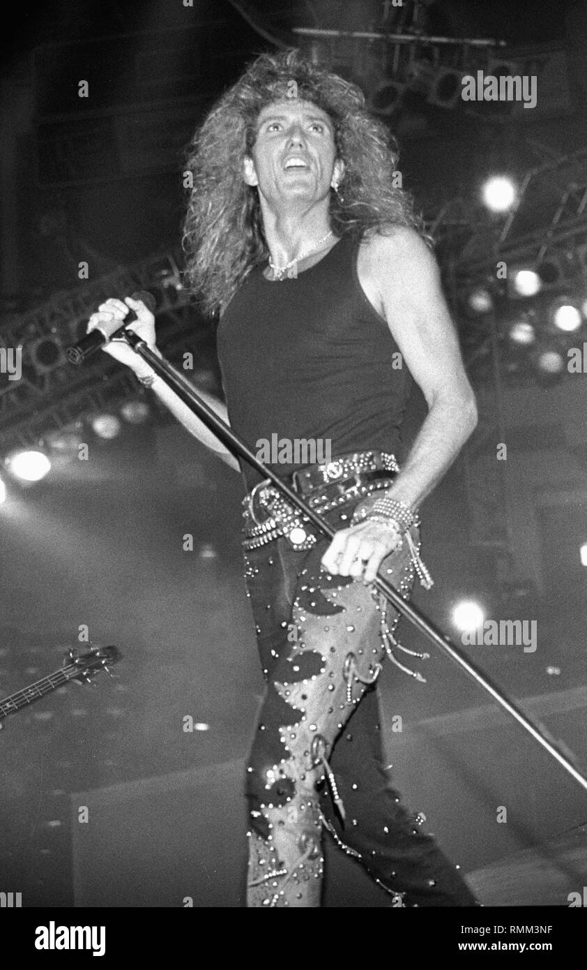Singer David Coverdale is shown performing on stage during a 'live' concert appearance Whitesnake. Stock Photo