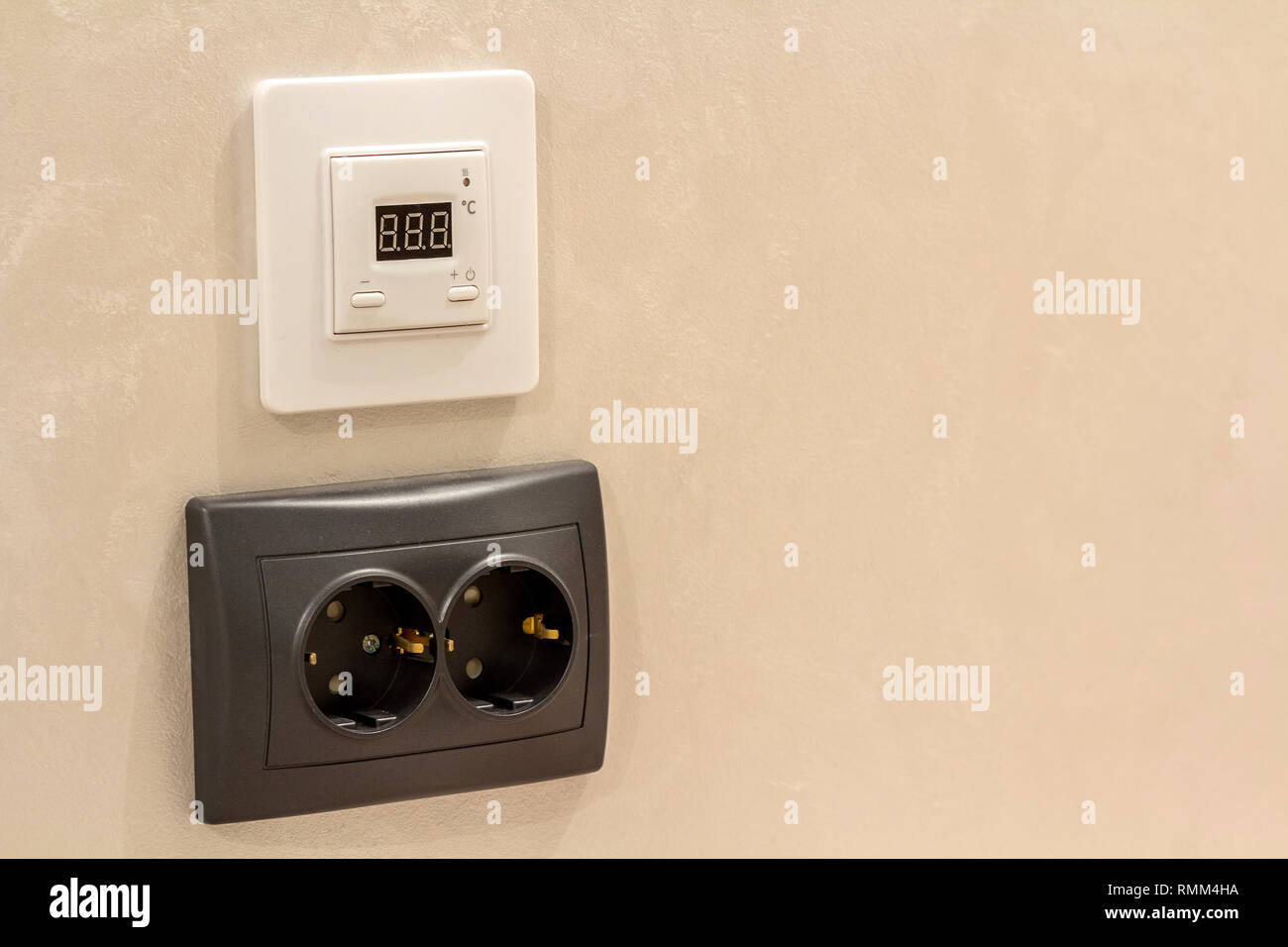 Double electric isolated socket and thermostat installed on light ...