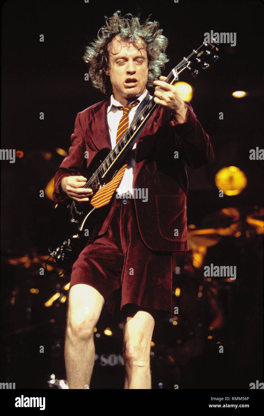 Ac/Dc guitarist Angus Young is shown performing 'live' in concert at the Hartford Civic Civic Center in Hartford, Connecticut. Stock Photo