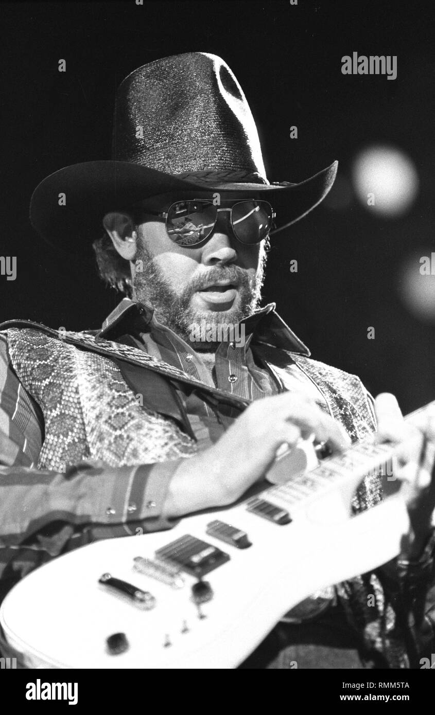 Singer, songwriter and guitarist Hank Williams Jr. is shown performing on stage during a 'live' concert appearance. Stock Photo