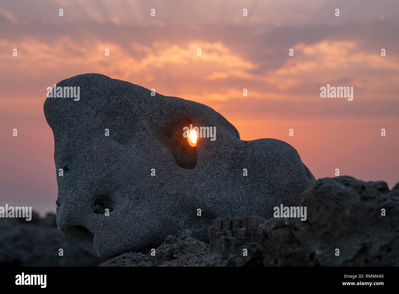 Hole in the stone, sunset sunrise Stock Photo
