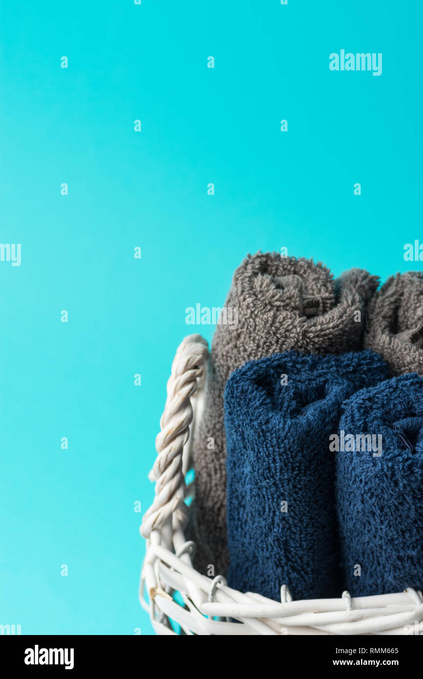 Rolled Clean Navy Blue Beige Terry Towels In White Wicker