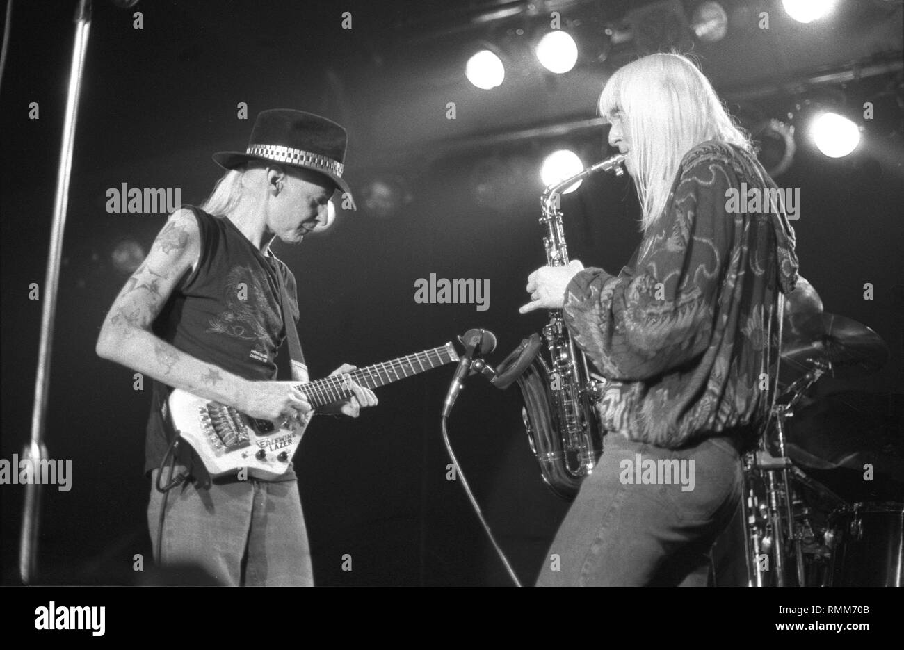 Brothers Johnny and Edgar WInter are shown performing on stage together during a 'live' concert appearance. Stock Photo