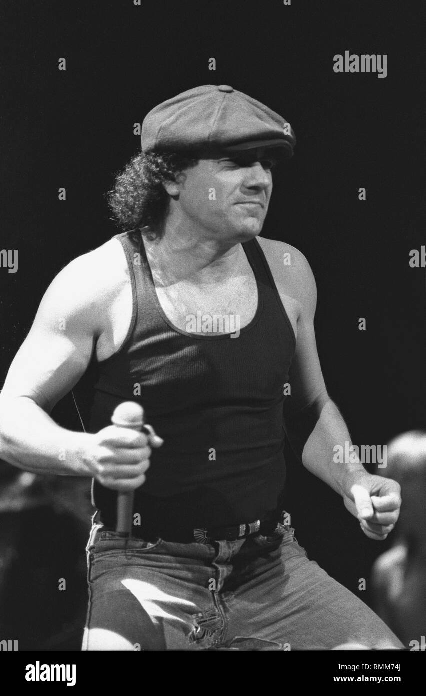 Ac Dc vocalist Brian Johnson is shown performing on stage during a 'live' concert appearance. Stock Photo