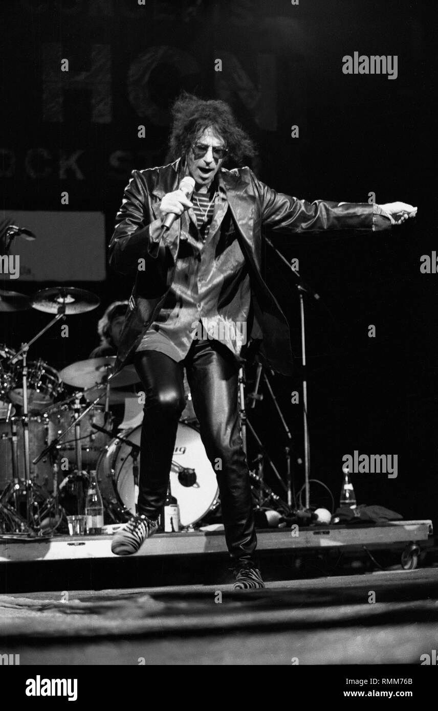 Singer Peter Wolf is shown performing on stage during a "live" concert appearance with his solo
