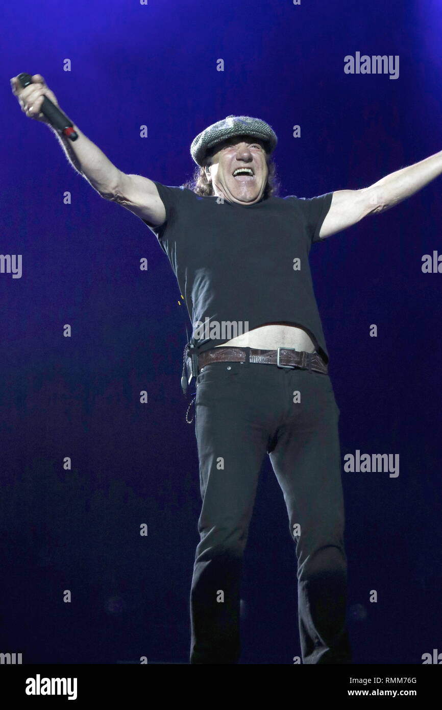 Singer Brian Johnson is shown performing on stage during a live concert appearance with Ac Dc. Stock Photo