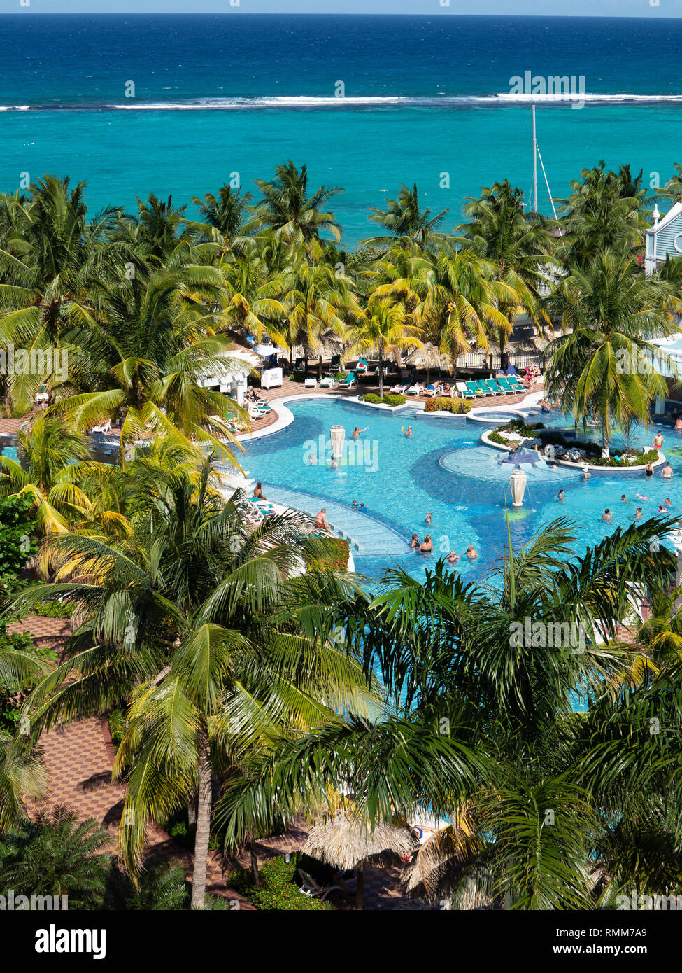 Ocho Rios Jamaica -1 February 2019: Caribbean swimming pool viewed  from above with sea in background Stock Photo