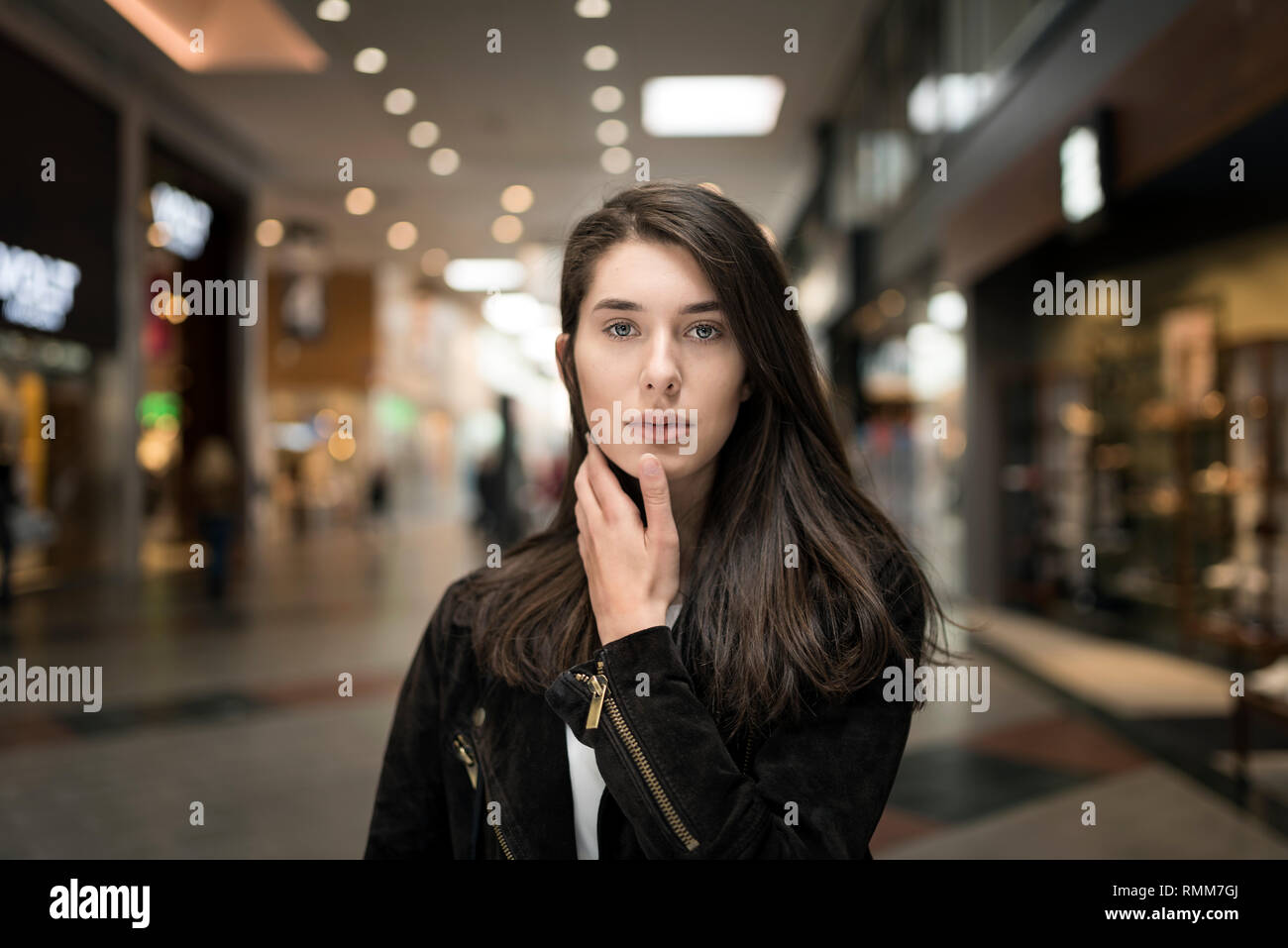 Portrait of woman in shopping center Stock Photo - Alamy