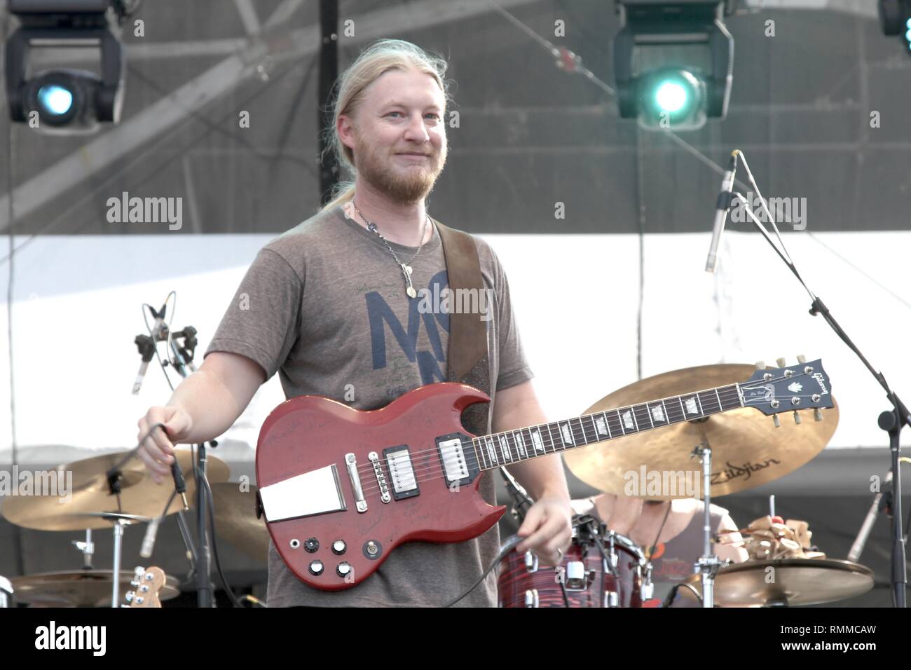 Guitarist Derek Trucks is shown performing on stage during a 'live' concert with Tedeschi & Trucks. Stock Photo