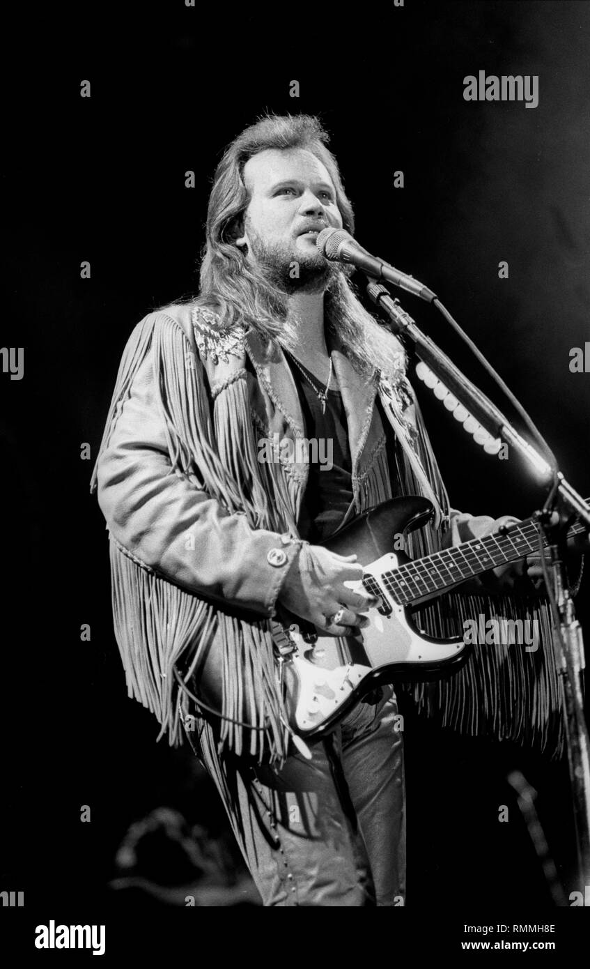 Grammy award winning country music artist and occasional actor Travis Tritt is shown performing on stage during a 'live' concert appearance. Stock Photo