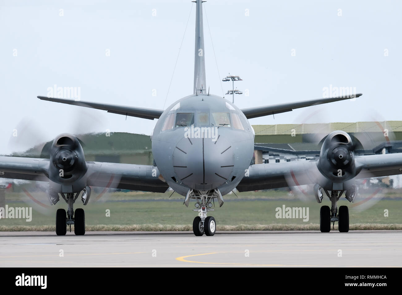 The front of a Boeing P-8 Poseidon military aircraft taxiing at RAF Lossiemouth aircraft base, Moray, Scotland Stock Photo