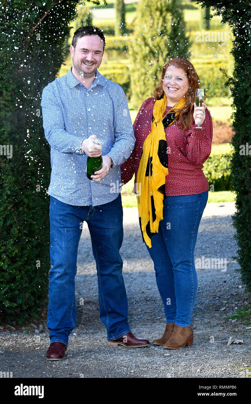 Andrew Symes and Natalie Metcalf, from Bristol, celebrate their £1 million win on the EuroMillions UK Millionaire Maker, at the De Vere Tortworth Court Hotel in Wotton-under-Edge, Gloucestershire. Stock Photo