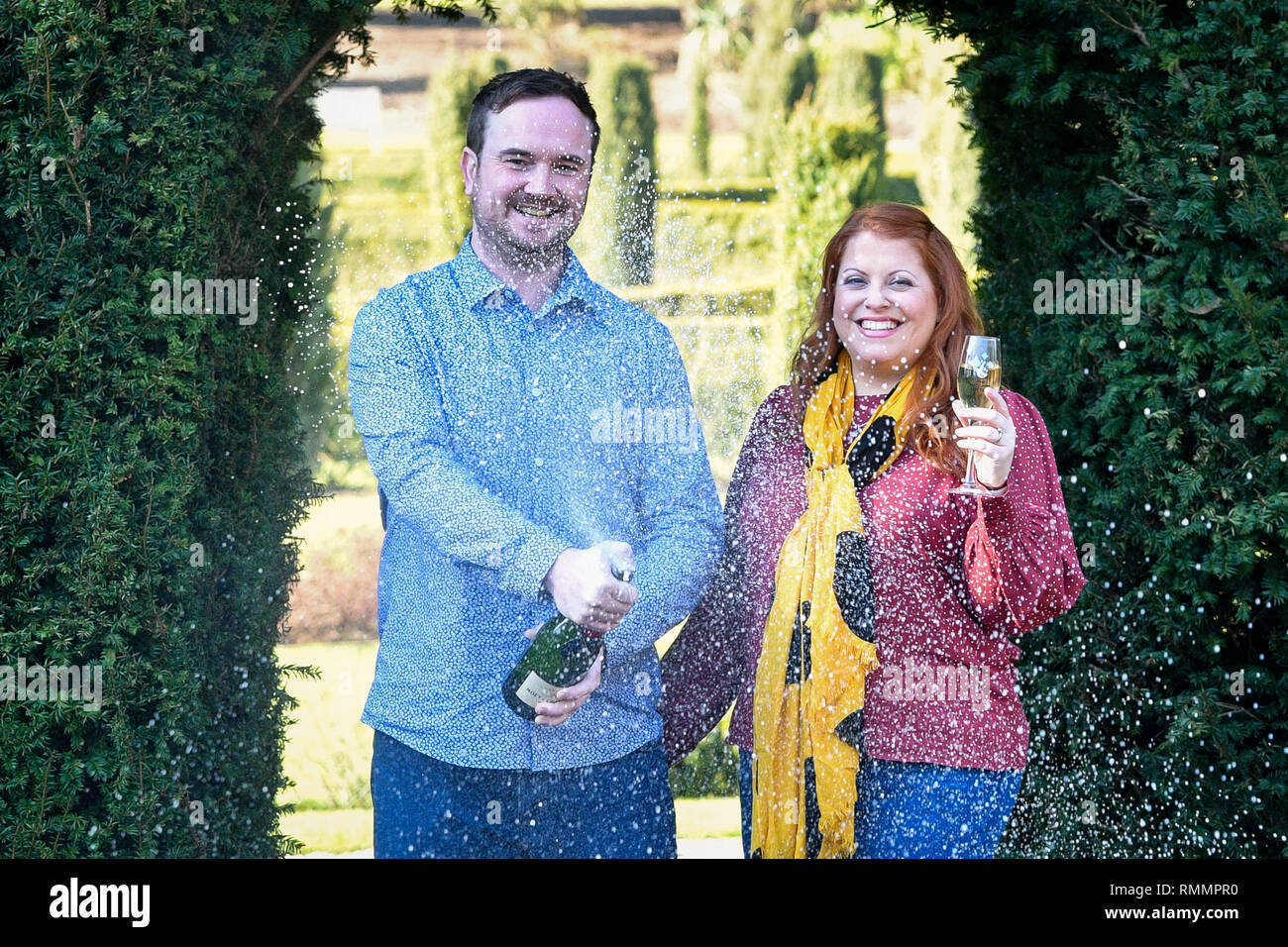 Andrew Symes and Natalie Metcalf, from Bristol, celebrate their £1 million win on the EuroMillions UK Millionaire Maker, at the De Vere Tortworth Court Hotel in Wotton-under-Edge, Gloucestershire. Stock Photo