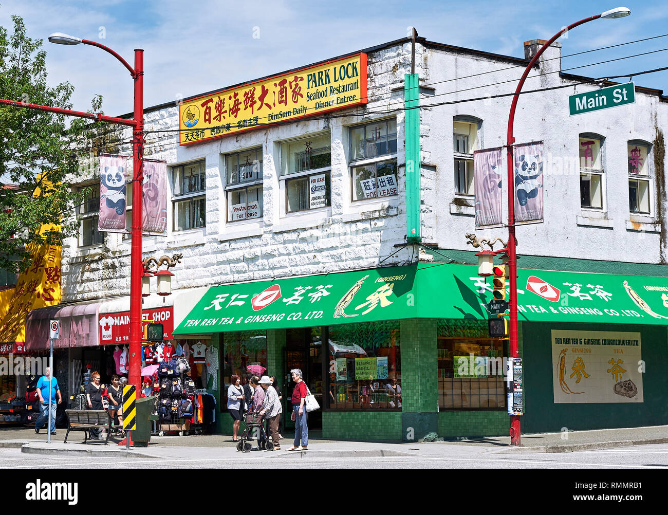 Vancouver, B.C., Canada - July 18, 2012: Detail view of a corner house with a chinese store at Main Street in Chinatown Stock Photo