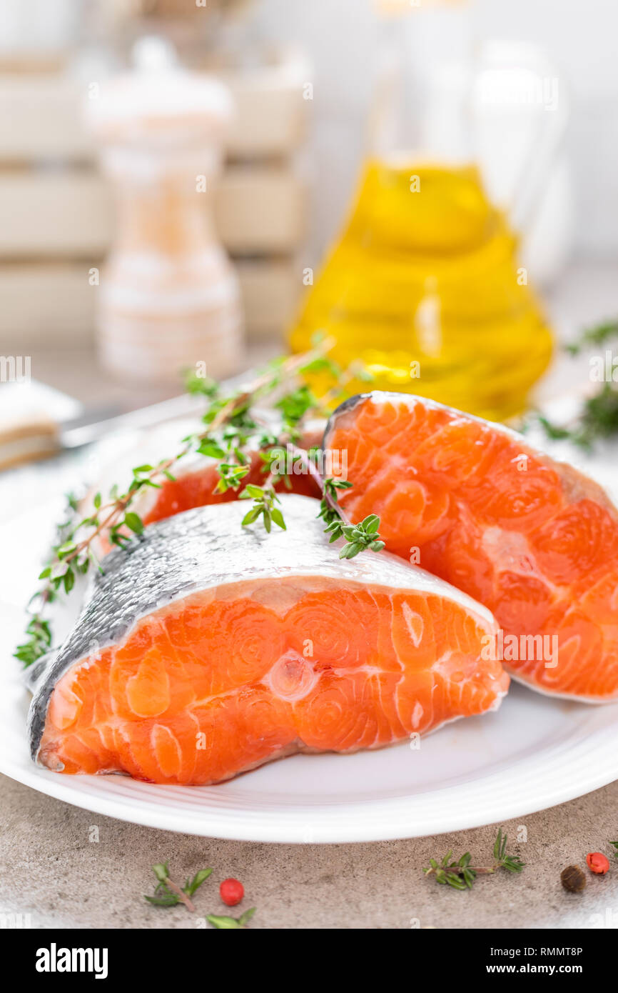 Fresh raw salmon fish steaks on white kitchen background Stock Photo ...