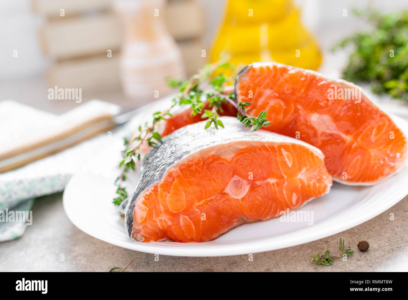 Fresh raw salmon fish steaks on white kitchen background Stock Photo ...