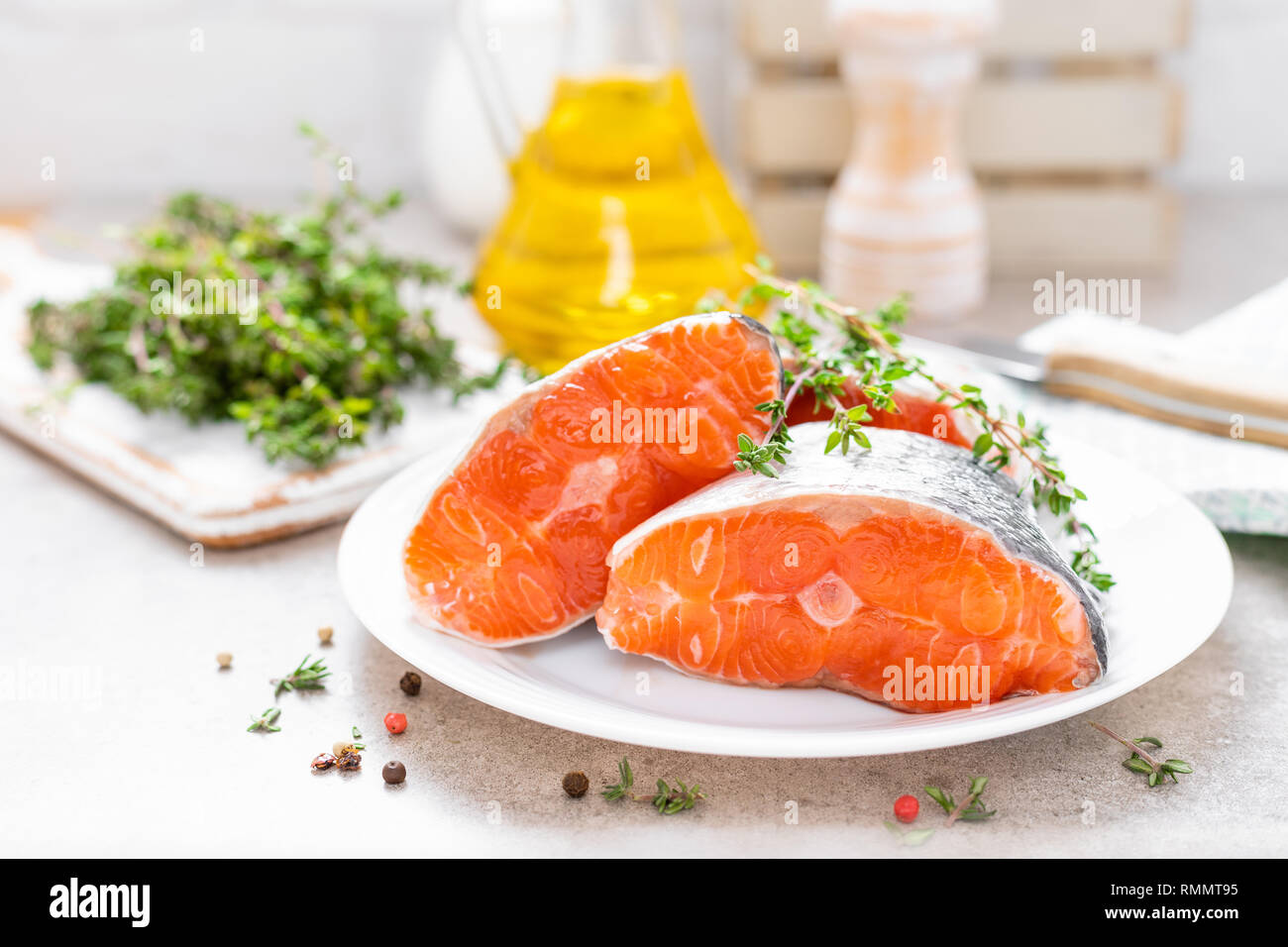 Fresh raw salmon fish steaks on white kitchen background Stock Photo ...