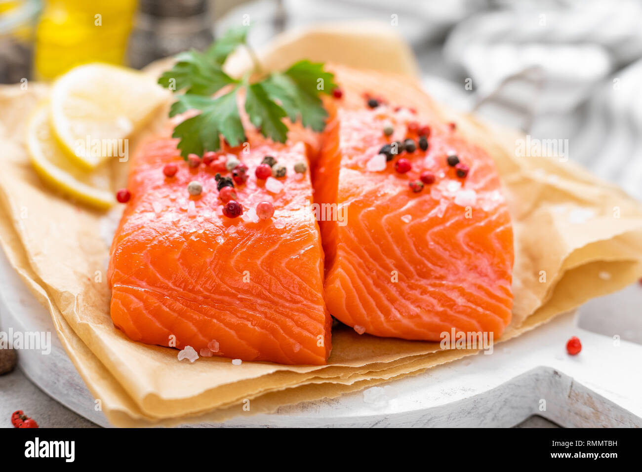Fresh raw salmon fish fillet on white kitchen background Stock Photo ...