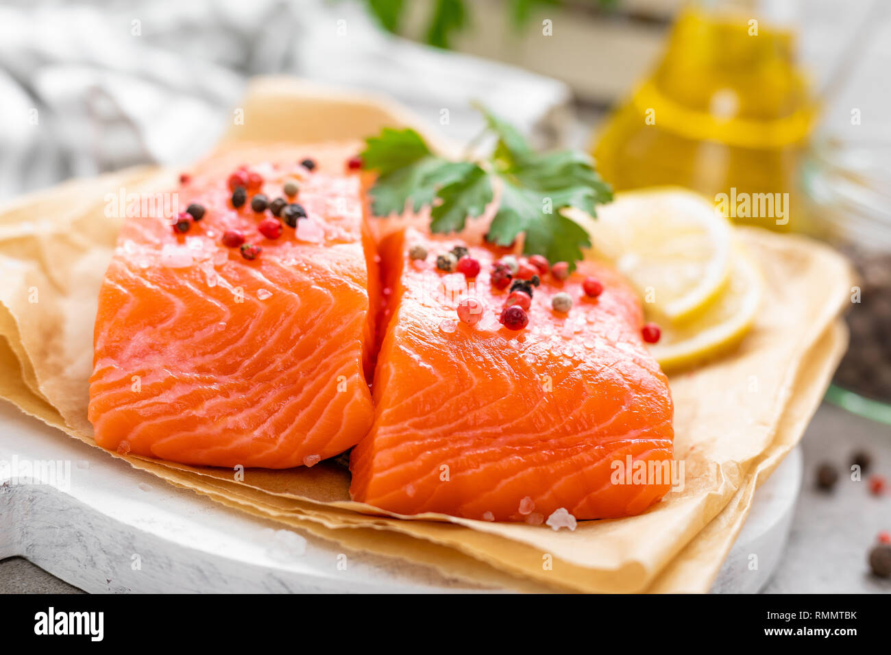 Fresh raw salmon fish fillet on white kitchen background Stock Photo ...
