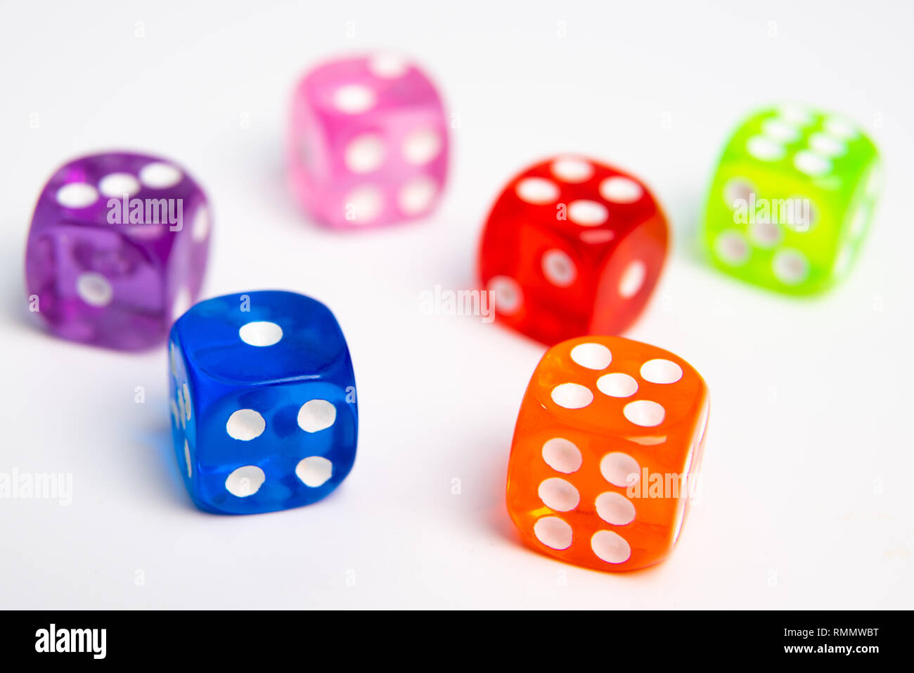 Dice of different colors isolated on a white background. Stock Photo