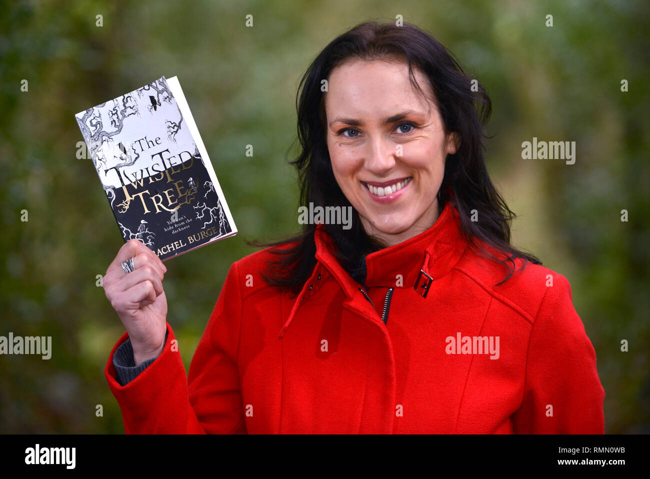 Author Rachel Burge withe her debut book The Twisted Tree, near her