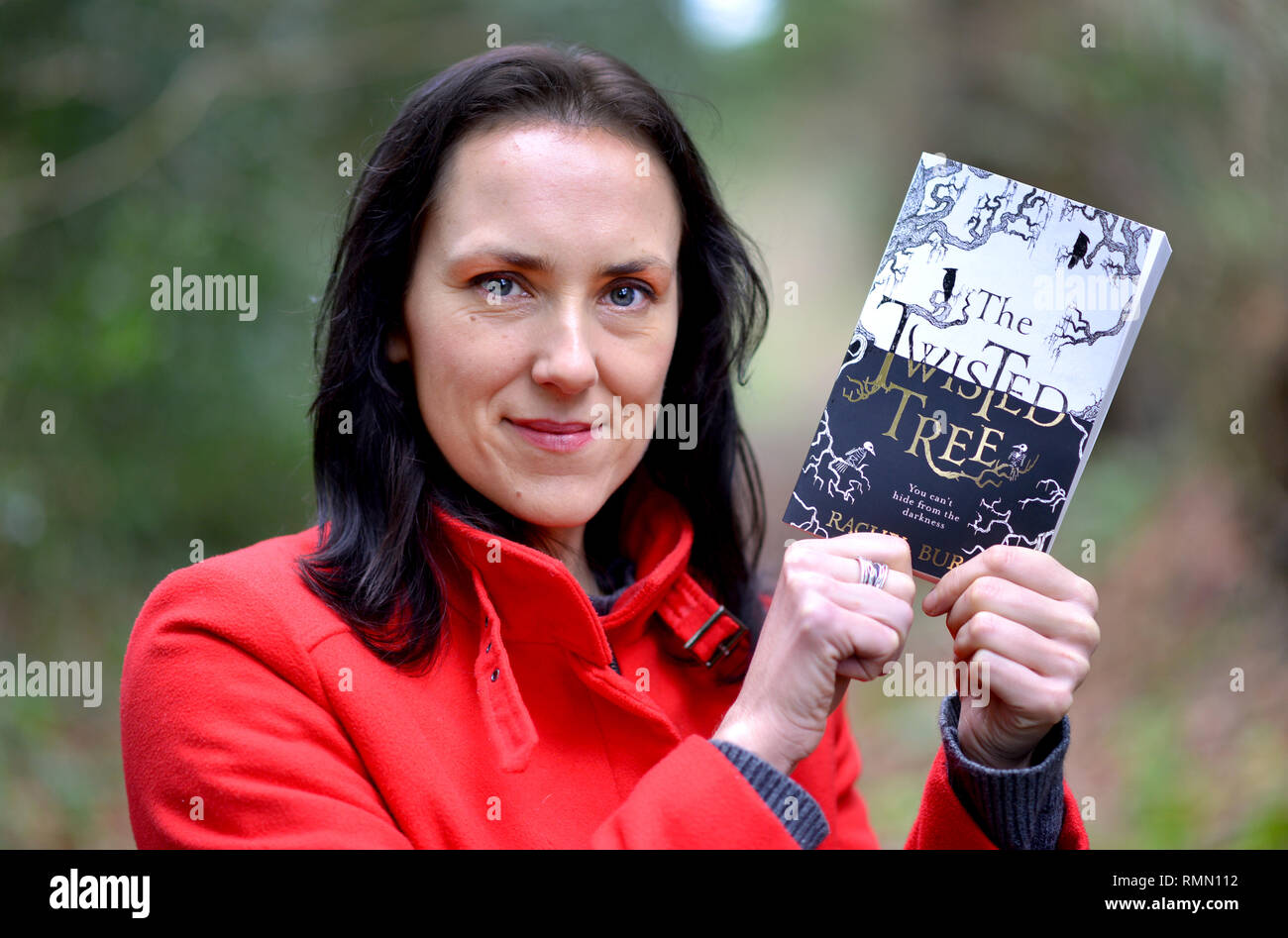 Author Rachel Burge withe her debut book The Twisted Tree, near her home in rural East Susserx