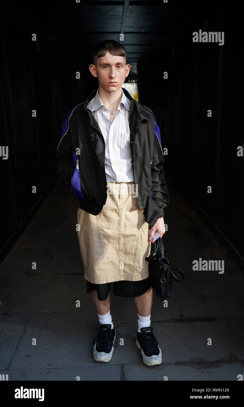 Styling student Joseph Parker wearing vintage jacket, Yves Saint Laurent shirt, Raf Simons shoes, and Vintage Guess skirt during the Autumn/ Winter 2019 London Fashion Week outside the BFC Show London