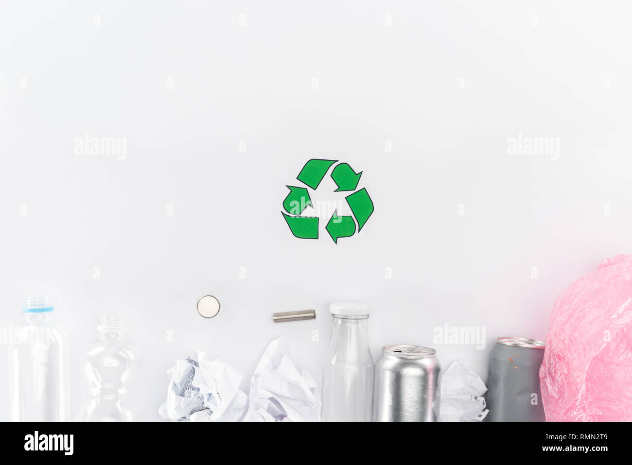 Top view of cans, plastic and glass bottles, batteries, paper