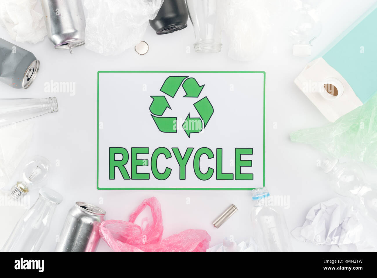 Cans, plastic and glass bottles, batteries, paper, bulb, carton bottle