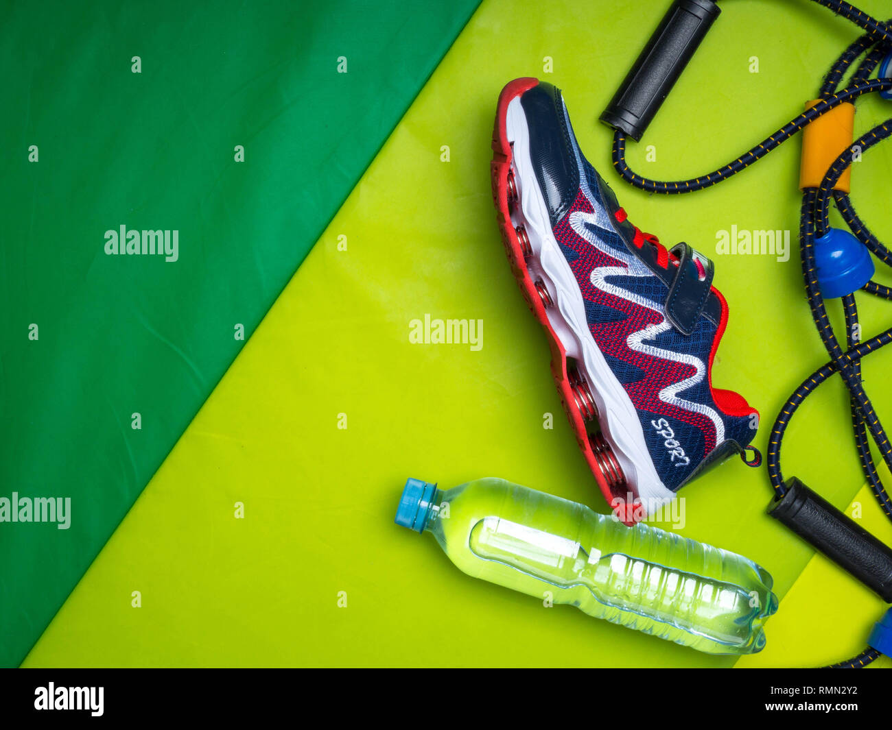 Sport green background water expanders, sport shoe with copy space on ...