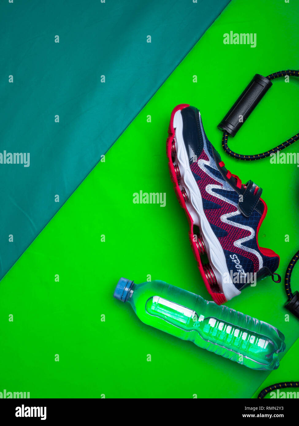 Sport green background water expanders, sport shoe with copy space on ...