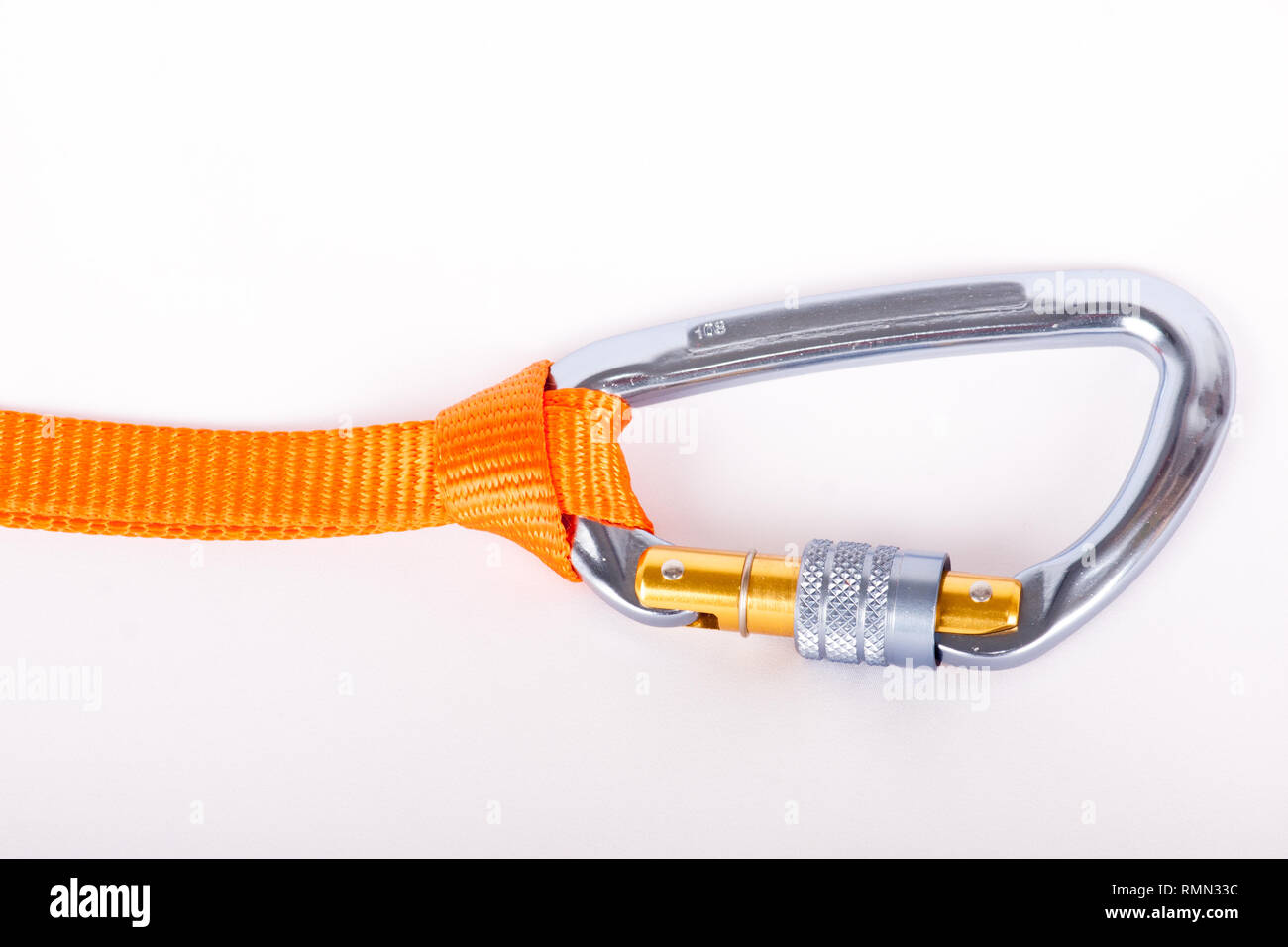 Escalade carabiner used in rock climbing with a strap attached Stock Photo