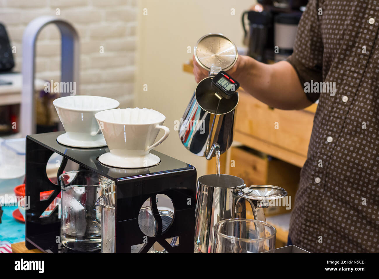 Barista hand drip Coffee making Brewing filter Bar Cafe Stock Photo