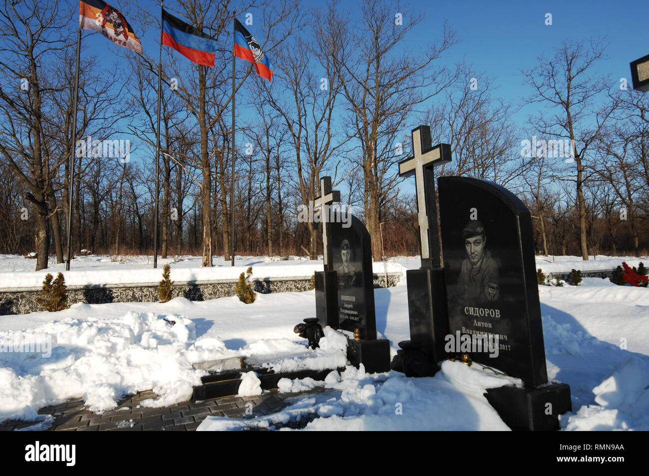 Grave headstones of war heroes from the Donetsk Peoples Republic lie in the cemetery on the outskirts of the city. The war between the Ukrainian army and the soldiers of the Donetsk Peoples Republic has cost the lives of 12,000 people and those who have been displaced exceed a million. It escalated in 2014. Despite a ceasefire in place, it is evident that death still occurs from predominantly, sniper, mortar and mines. The construction of trenches either side of no-man’s land, (often only 100mt apart) have ensured a static yet aggressive confrontation. The Minsk ceasefire agreement and constan Stock Photo