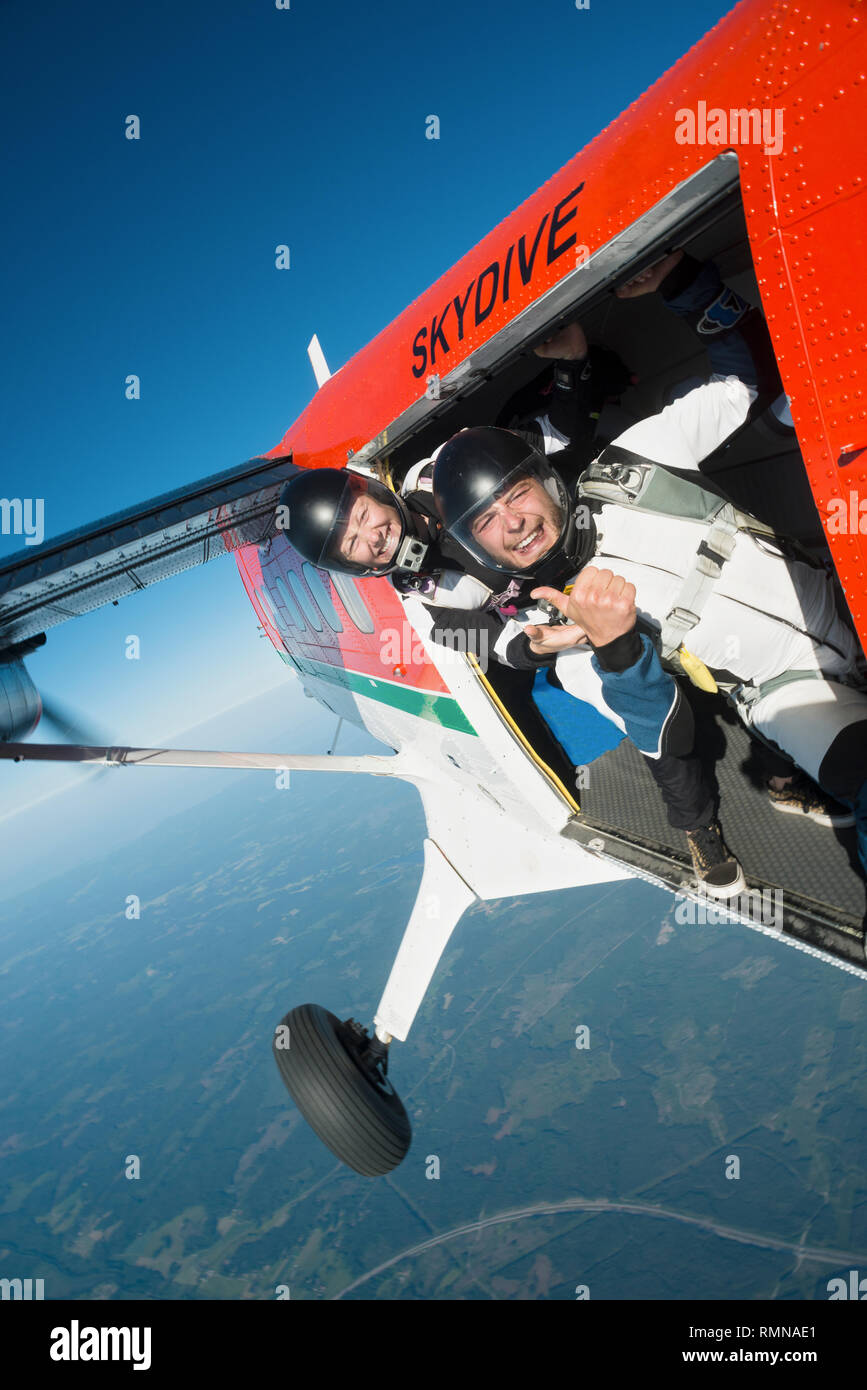 Skydivers in plane Stock Photo