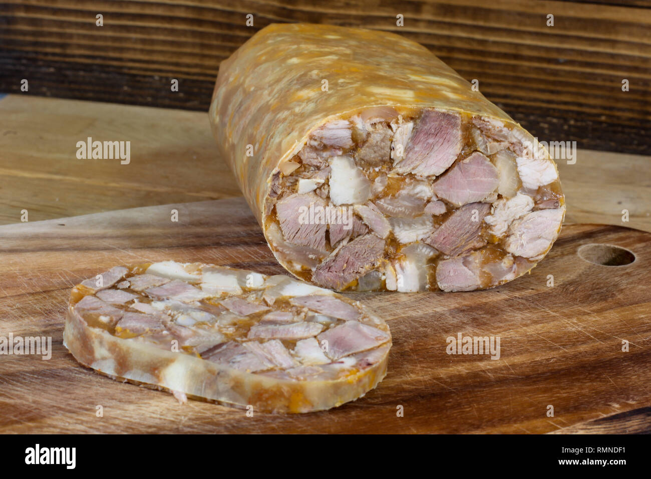 Home made head cheese on wooden background Stock Photo